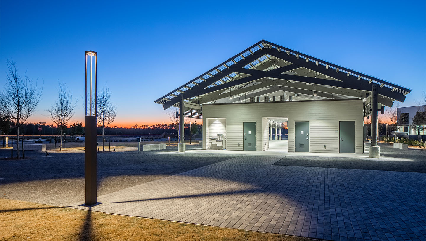 Lumiquad  illuminates exterior of building at dusk